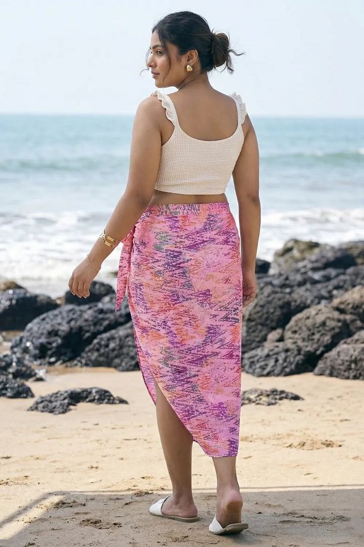 Pretty pink bikini coverup sarong with an off-white top