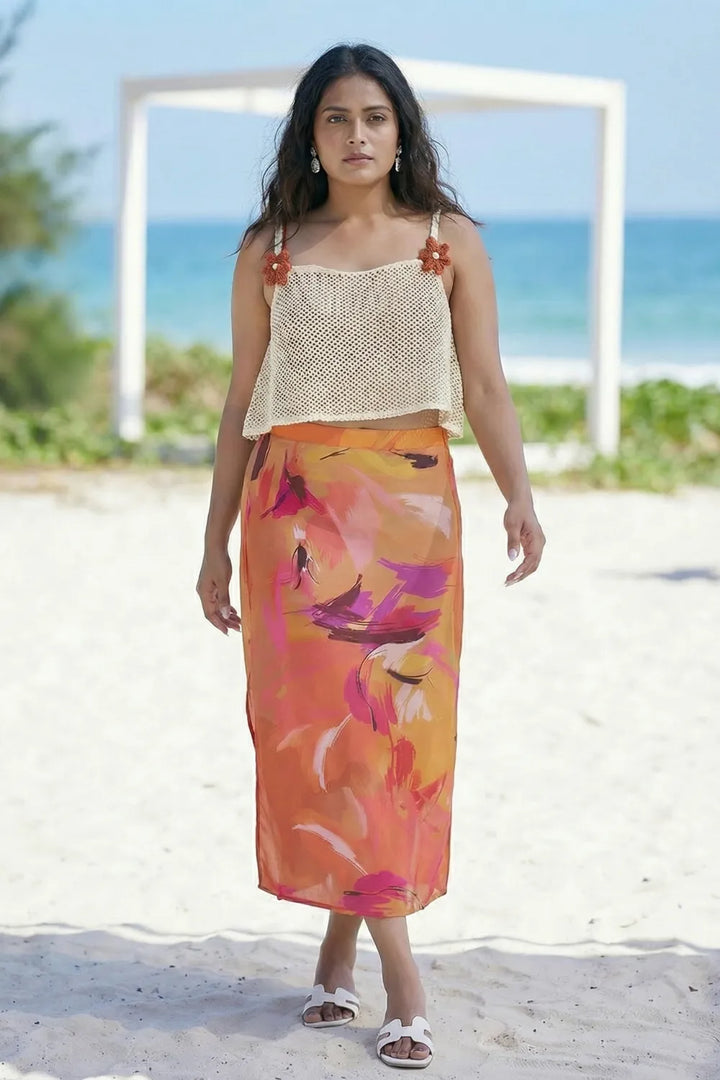 Curvylane's sheer coverup top with an abstract orange sarong