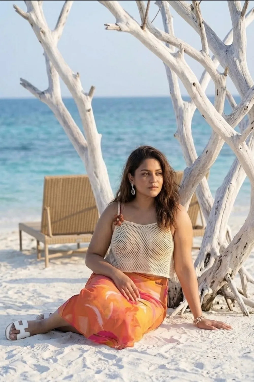 Curvylane's sheer coverup top with an abstract orange sarong