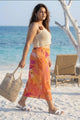 Curvylane's sheer coverup top with an abstract orange sarong