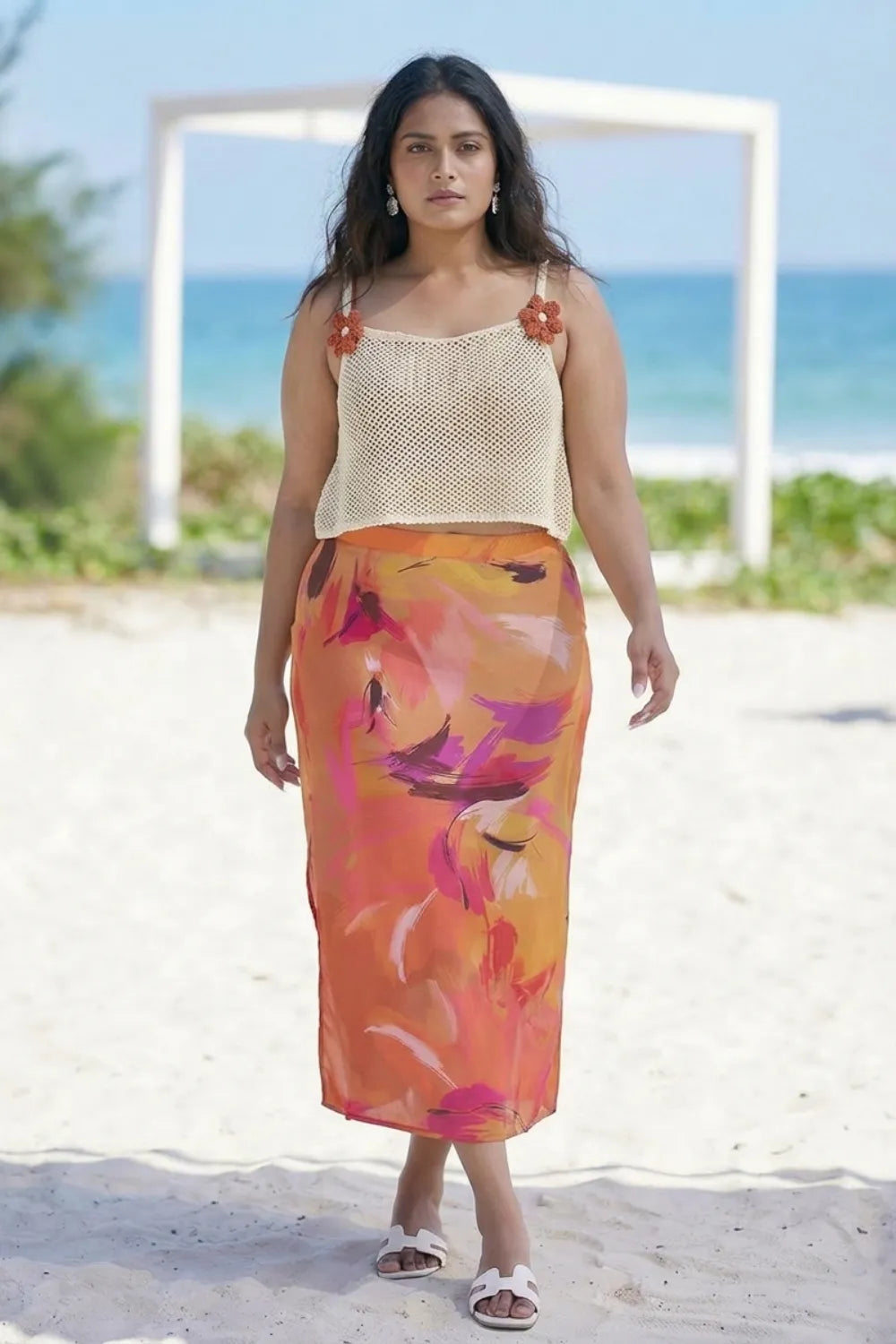 Curvylane's sheer coverup top with an abstract orange sarong
