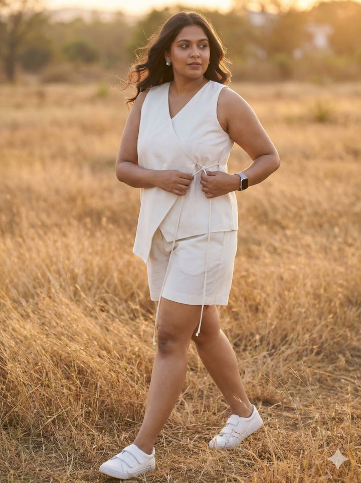 Woman in a white outfit standing in a field during sunset [Buy Summer Co Ord Set for Women Online]