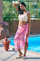 Pretty pink bikini coverup sarong with an off-white top