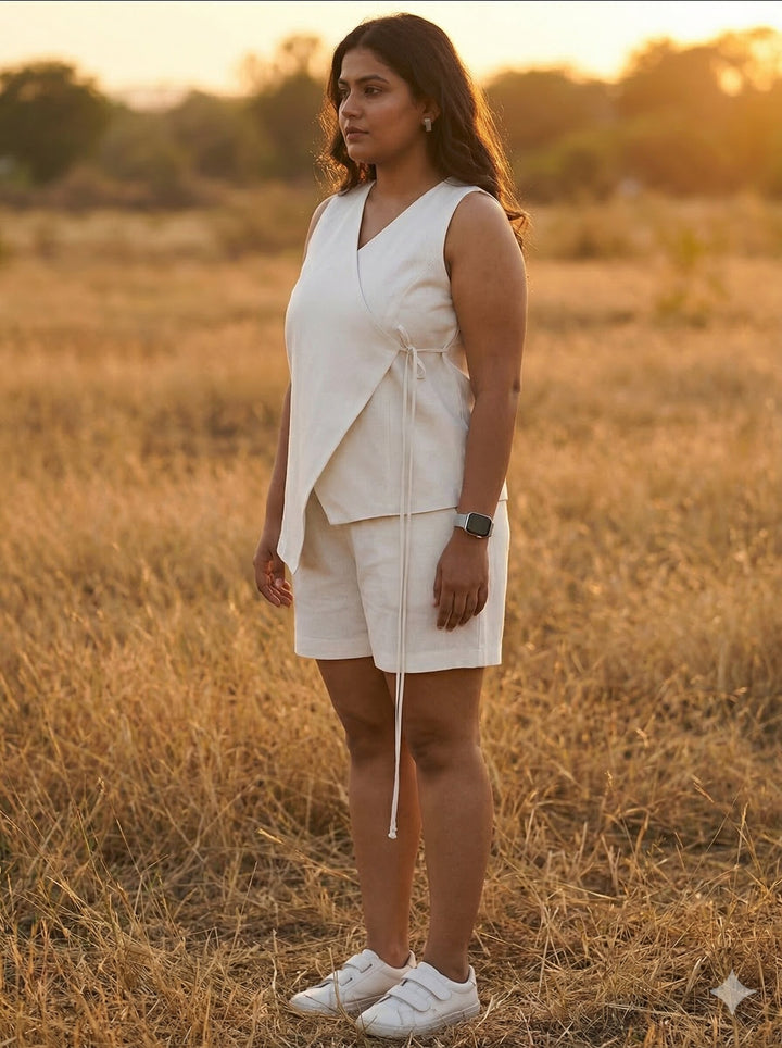 Woman in a white outfit standing in a field during sunset [Buy Summer Co Ord Set for Women Online]