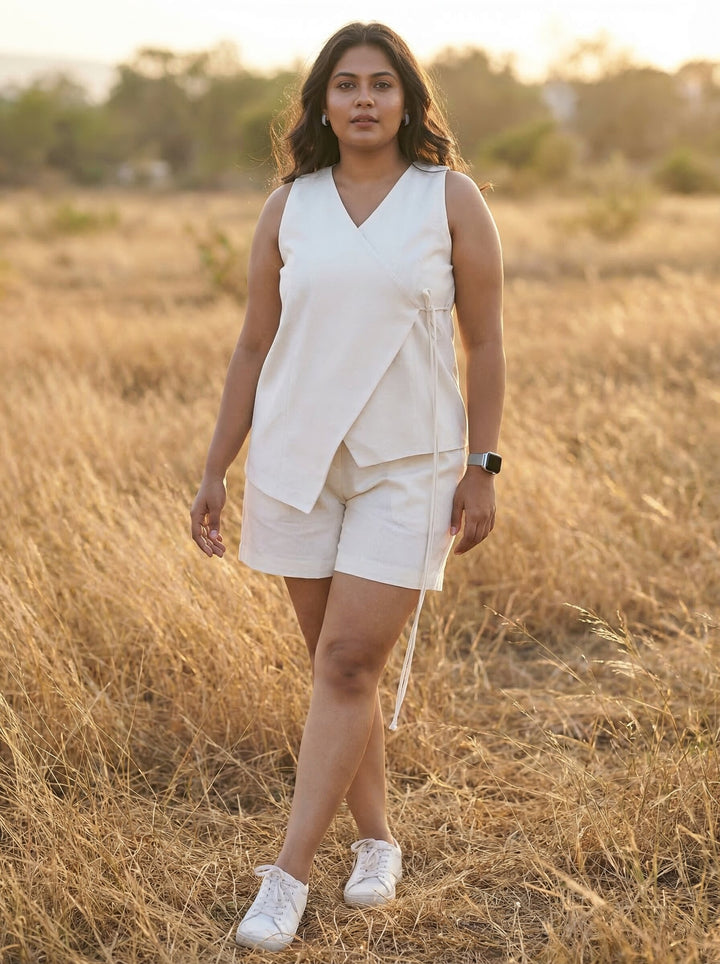 Buy Summer Co Ord Set for Women Online - Woman in a white outfit standing in a field with a sunset background
